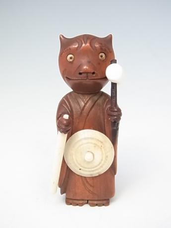 JAPANESE EARLY 20TH CENTURY KOBE TOY IN THE SHAPE OF AN ONI DRESSED AS A MONK<br><font color=red><b>SOLD</b></font> 