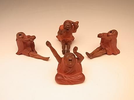 JAPANESE EARLY 20TH CENTURY SET OF CARVED DARUMA (4)<br><font color=red><b>SOLD</b></font> 